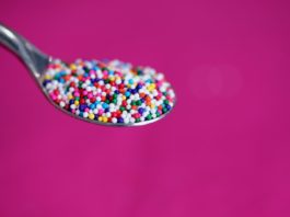 multicolored icing on stainless steel spoon